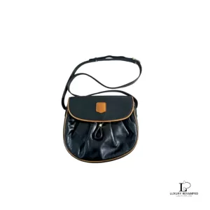 Pre-loved Celine half moon black leather crossbody bag with tan trim, front view – secondhand designer, NZ