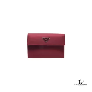 Pre-loved Prada maroon Tessuto nylon trifold medium wallet with logo plaque, front view – secondhand designer, NZ