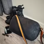 Pre-loved Chloé Sam black leather shoulder bag with brown trim, front view – secondhand designer, NZ