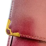 Must de Cartier bordeaux leather medium bifold wallet with gold-tone hardware, view 11