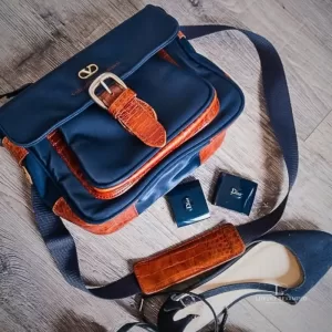 Pre-loved Valentino Garavani Sports navy blue and brown nylon and leather crossbody bag, front view – secondhand designer, NZ