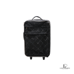 Pre-loved vintage Chanel Old Travel Line black nylon rolling suitcase with padlock and key, front view – secondhand designer, NZ