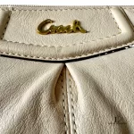Coach cream leather wristlet mini handbag with gold-tone logo, view 10