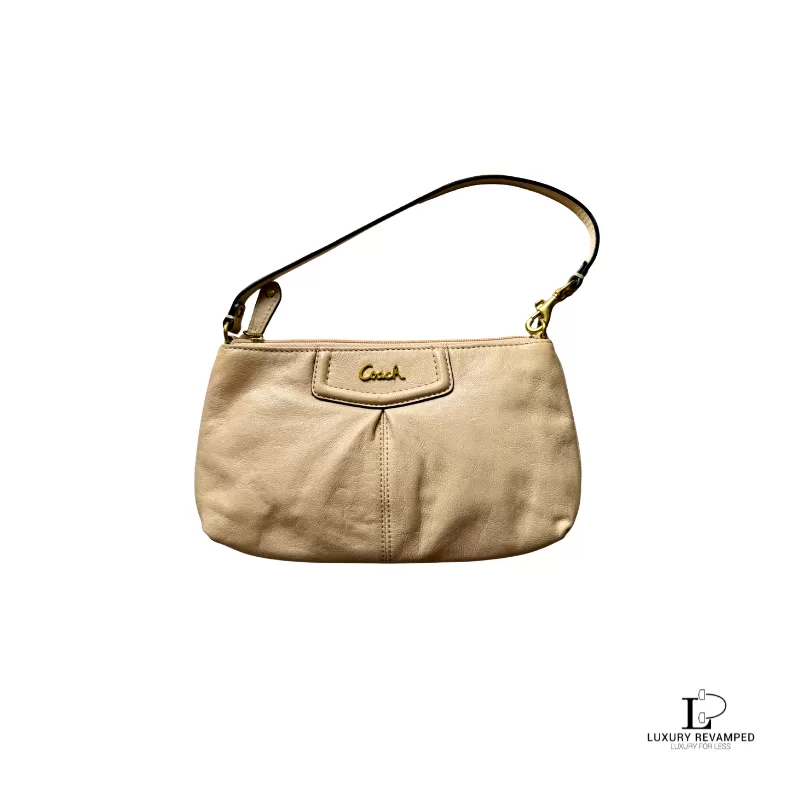 Pre-loved Coach cream leather wristlet mini handbag with gold-tone logo, front view – secondhand designer, NZ