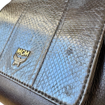 MCM black leather crossbody bag with scale-like flap and gold logo, view 23