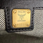 MCM black leather crossbody bag with scale-like flap and gold logo, view 16