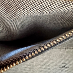 MCM black leather crossbody bag with scale-like flap and gold logo, view 17