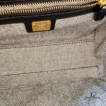 MCM black leather crossbody bag with scale-like flap and gold logo, view 18