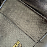MCM black leather crossbody bag with scale-like flap and gold logo, view 22