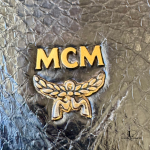 MCM black leather crossbody bag with scale-like flap and gold logo, view 21