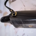 MCM black leather crossbody bag with scale-like flap and gold logo, view 11