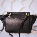 MCM black leather crossbody bag with scale-like flap and gold logo, view 3