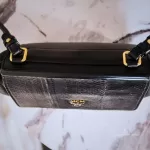 MCM black leather crossbody bag with scale-like flap and gold logo, view 10