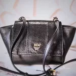 MCM black leather crossbody bag with scale-like flap and gold logo, view 2