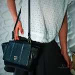 MCM black leather crossbody bag with scale-like flap and gold logo, view 25