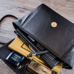 MCM black leather crossbody bag with scale-like flap and gold logo, view 28