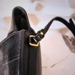 MCM black leather crossbody bag with scale-like flap and gold logo, view 13