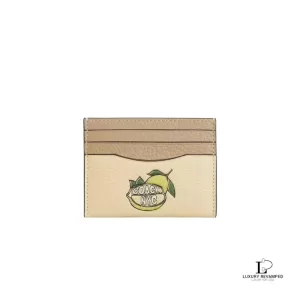 Pre-loved Coach slim ID card case in Moonlight pebble calf leather with lemon graphic, new with tag, front view – secondhand designer, NZ