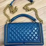 Luxury Revamped - Chanel Blue Quilted Patent Leather Boy Bag – The Reserve Edit – view 3 | authenticated pre-loved luxury