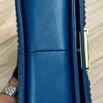 Luxury Revamped - Chanel Blue Quilted Patent Leather Boy Bag – The Reserve Edit – view 4 | authenticated pre-loved luxury