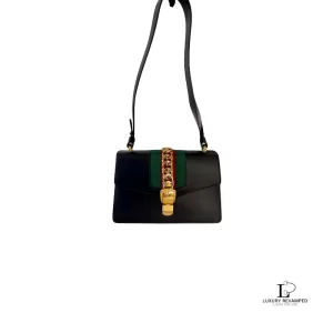 Pre-loved Gucci Sylvie small black leather shoulder bag with Web ribbon strap, front view – secondhand designer, NZ
