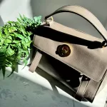 Pre-loved Yves Saint Laurent Muse Two taupe leather two-way handbag, front view – secondhand designer, NZ