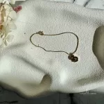 Pre-loved Christian Dior CD gold-tone bracelet, front view – secondhand designer, NZ