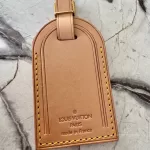 Louis Vuitton Vachetta leather travel accessory set with padlock, luggage tag and poignet, view 6