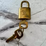 Louis Vuitton Vachetta leather travel accessory set with padlock, luggage tag and poignet, view 5