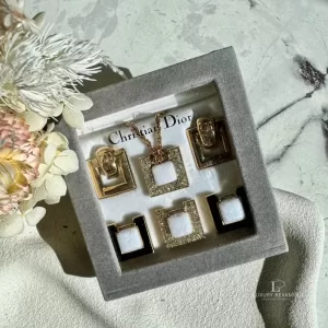 Pre-loved vintage Christian Dior CD interchangeable gold-tone and rhinestone necklace and earrings set, front view – secondhand designer, NZ