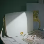 Pre-loved Furla Melody white pebbled leather shoulder bag, front view – secondhand designer, NZ